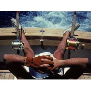  Man Takes a Break from Fishing on a Boat in the Bahamas 