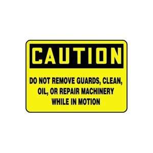 CAUTION DO NOT REMOVE GUARDS, CLEAN, OIL, OR REPAIR MACHINERY WHILE IN 