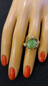   gold ring w/oval jade stone and 2 round diamond accent stones  