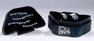   her rings in a little collectible box with wedding vows inscribed on