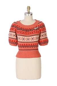   is made modern with voluminous sleeves and soft coral hue let a