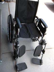 Used Wheelchair, tire lock 17wx18dx18h w/foot rests  