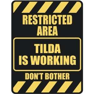   RESTRICTED AREA TILDA IS WORKING  PARKING SIGN