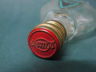   empty bottle, marked on base 100 cm3, with the original labels