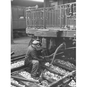  Crewman Working on Train Beside Platform at Union Station 