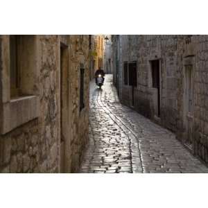  Scooter Riding Down Cobbled Backstreet by Will Salter 