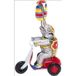  Tin wind up circus elephant on scooter figurine