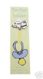 Simply clip charm to childs shirt. Attach pacifier to ribbon with 