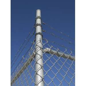  Secure Chain Link Fence Topped with Barbed Wire Stretched 