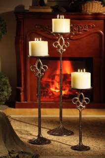 This set of 3 cast iron floor pillar candle holder make a beautiful 