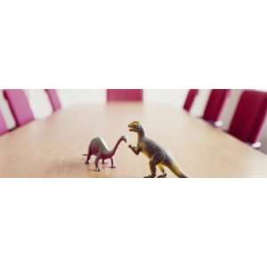  Two Dinosaur Toys on a Conference Table Photographic 